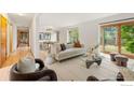 Well-lit living room with a modern design, stylish furniture, and access to outdoor spaces at 701 Kalmia Ave, Boulder, CO 80304