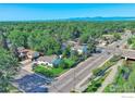 Expansive aerial view showcasing the neighborhood's lush greenery and tree-lined streets, highlighting its serene setting at 1209 S Terry St, Longmont, CO 80501
