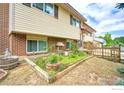 Picture of a well-maintained side yard with a charming garden bed and a classic wooden fence at 1209 S Terry St, Longmont, CO 80501