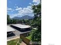 Scenic view of mountains from the parking area, with greenery, blue sky and scattered clouds at 2227 Canyon Blvd # 359B, Boulder, CO 80302