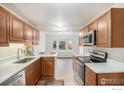 Bright kitchen features stainless steel appliances, light countertops and traditional wood cabinetry at 2254 Spruce St # A, Boulder, CO 80302