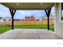 View of a backyard featuring a concrete patio and green lawn at 2397 Bristol St, Superior, CO 80027