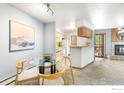 Inviting living area with a dining space and a view into the adjacent kitchen at 2800 Kalmia Ave # C205, Boulder, CO 80301