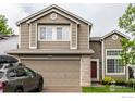 Beautiful exterior view featuring a two-car garage and classic design at 3101 Goldeneye Pl, Superior, CO 80027