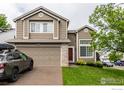 Inviting two-story home with a well-manicured lawn and traditional design at 3101 Goldeneye Pl, Superior, CO 80027