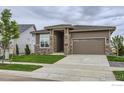 Beautiful house exterior showcasing the front yard, landscape, and stylish curb appeal at 3166 Newfound Lake Rd, Berthoud, CO 80513
