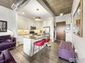 Open concept kitchen with island seating and stylish finishes at 3401 Arapahoe Ave # 402, Boulder, CO 80303