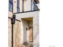 Modern home entrance with light wood door, accent lighting, and natural wood siding at 358 Arapahoe Ave # B, Boulder, CO 80302