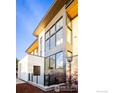 Stylish modern exterior with large windows and sleek lines, set against a blue sky at 358 Arapahoe Ave # B, Boulder, CO 80302