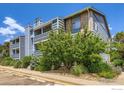 Multi-story condo with brick and siding, mature landscaping, and ample parking spaces in a desirable location at 4670 White Rock Cir # 1, Boulder, CO 80301