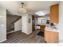 Well-lit kitchen with wood-look flooring, stainless steel appliances, and ample cabinet space at 51 21St Ave # 43, Longmont, CO 80501
