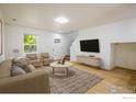 Inviting living room featuring a modern design, hardwood floors, and ample natural light at 5225 E 100Th Dr, Thornton, CO 80229
