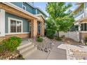 Charming two-story home with a landscaped front yard and inviting entrance at 64 Whitehaven Cir, Highlands Ranch, CO 80129