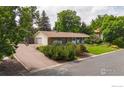 Spacious single-Gathering home with a long driveway and attached garage at 7290 Mount Sherman Rd, Longmont, CO 80503