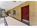 Exterior view of building featuring a red door, metal stairs, and a convenient location at 830 20Th St # 203, Boulder, CO 80302