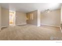 Open living room featuring neutral paint and plush carpeting throughout at 830 20Th St # 203, Boulder, CO 80302