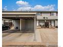 Exterior view of the home featuring carport and front entrance at 8746 Carr Loop, Arvada, CO 80005