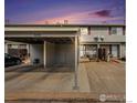 Exterior view of the home featuring carport and front entrance at 8746 Carr Loop, Arvada, CO 80005