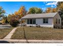Lovely single-story home featuring a well-maintained lawn, complemented by a concrete walkway at 1109 Ironton St, Aurora, CO 80010