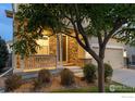 Charming home with a stone-accented entryway, cozy porch, and well-maintained landscaping leading to the front door at 1365 15Th Ave, Longmont, CO 80501