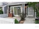 Charming front patio with decorative lattice shelf for outdoor living and curb appeal at 154 Blue Spruce Ct, Highlands Ranch, CO 80126
