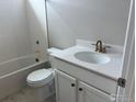 Cozy bathroom featuring a shower-tub combo, white vanity, and modern fixtures at 1713 Jennifer St, Brighton, CO 80601