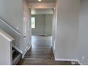 Inviting home entryway featuring hardwood floors that transition to the living space beyond at 1783 Jennifer St, Brighton, CO 80601