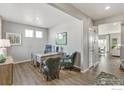 Well-lit home office featuring hardwood floors, neutral walls, and stylish decor for a professional workspace at 1907 Mount Monroe Dr, Berthoud, CO 80513