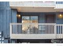 Exterior apartment showing unit number with private balcony and outdoor lighting at 2800 Kalmia Ave # A220, Boulder, CO 80301