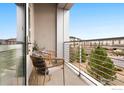 Cozy balcony with seating and views of the surrounding neighborhood at 2958 Syracuse St # 306, Denver, CO 80238