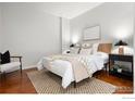 Serene bedroom with a comfortable bed and minimalist decor at 2958 Syracuse St # 306, Denver, CO 80238