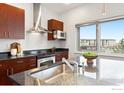 Modern kitchen with stainless steel appliances and granite countertops at 2958 Syracuse St # 306, Denver, CO 80238