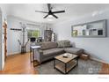 Bright living room with hardwood floors, ceiling fan and neutral decor, offers a welcoming space at 3730 Lowell Blvd, Denver, CO 80211