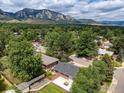 Scenic aerial view showcasing the property's backyard, patio, and mountain views at 1100 Berea Dr, Boulder, CO 80305