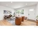 Bright living room with hardwood floors, large windows, and stylish contemporary furniture at 1100 Berea Dr, Boulder, CO 80305