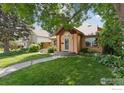 Inviting single-Gathering home showcasing a lush front lawn and mature trees at 2030 Columbine Ave, Boulder, CO 80302