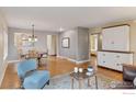 Open-concept living room with hardwood floors, eat-in kitchen, and modern furnishings at 2030 Columbine Ave, Boulder, CO 80302