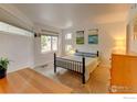 Comfortable bedroom with carpet flooring and bright sunlight streaming through multiple windows at 2850 E College Ave # 110, Boulder, CO 80303
