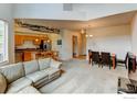 Open floor plan with a living room, dining area, and kitchen, perfect for entertaining guests at 2850 E College Ave # 110, Boulder, CO 80303