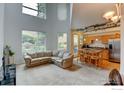 Spacious living room area featuring large windows, a comfortable couch, and plenty of natural light at 2850 E College Ave # 110, Boulder, CO 80303