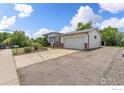 Quaint house with a well-kept lawn and mature landscaping including an over-sized driveway at 3792 E 114Th Dr, Thornton, CO 80233