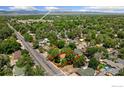Aerial view showing property boundaries in a green, tree-filled neighborhood near Longmont High School at 1220 9Th Ave, Longmont, CO 80501