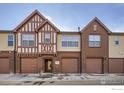 Attractive multi-Gathering home with brick and tudor-style accents and attached garages at 1379 Charles Dr # 4, Longmont, CO 80503