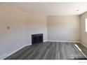Neutral Living room with laminate flooring and minimalist fireplace at 3051 Craft Way, Westminster, CO 80030