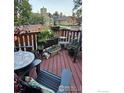 Inviting deck with comfortable seating, potted plants, and decorative accents perfect for outdoor relaxation at 6504 Ralston Rd, Arvada, CO 80002