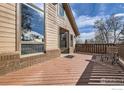 Spacious deck with room to relax and entertain, complemented by a sunny day at 6504 Ralston Rd, Arvada, CO 80002