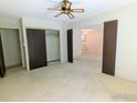 Bedroom with ample closet space and ceiling fan at 7040 E Girard Ave # 103, Denver, CO 80224