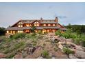 Luxury home exterior showcasing a large, rustic design at 11780 Gold Hill Rd, Boulder, CO 80302