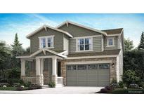 Charming two-story home featuring a stone garage, covered porch, and craftsman-style accents at 656 N Clubview St, Watkins, CO 80137