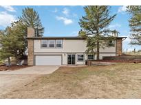 Charming two-story home with a two-car garage and stone accents at 1604 Lisbon Dr, Parker, CO 80138
